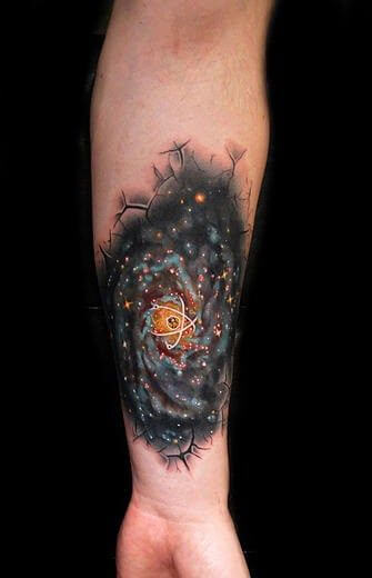 space inspired tattoo on forearm