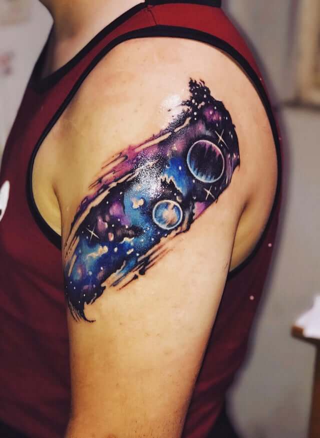 space inspired tattoo on shoulder