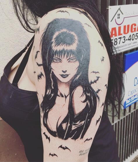 stunning elvira tattoo on upper sleeeve