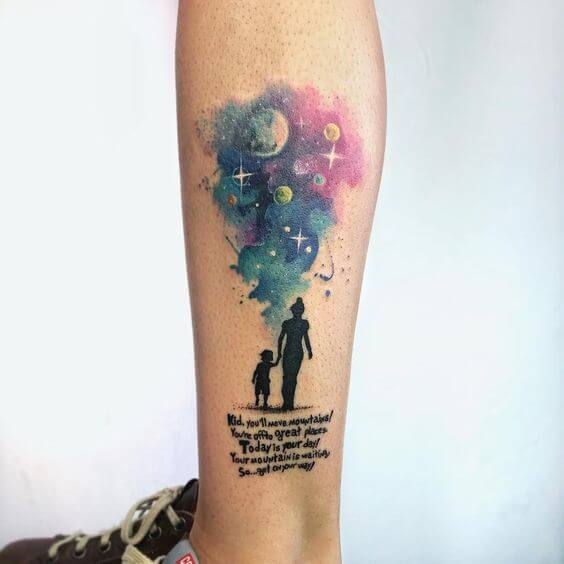 watercolor quote and astronomy tattoo on leg