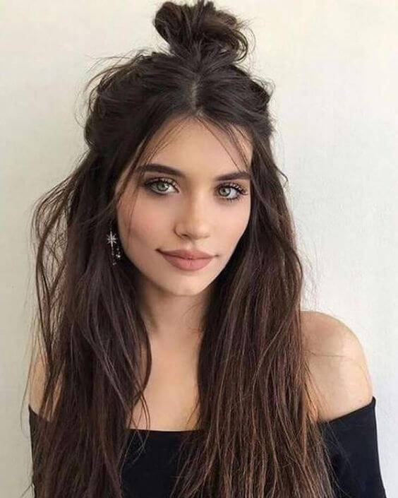 cute messy bun with layers and curls hairstyle for winter