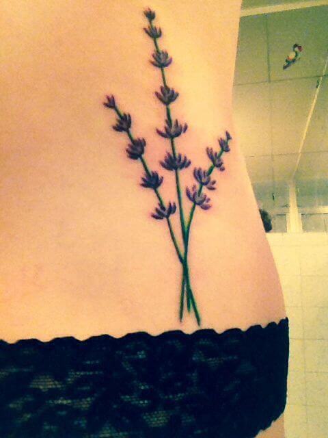 lavender sprig tattoos on side lower back
