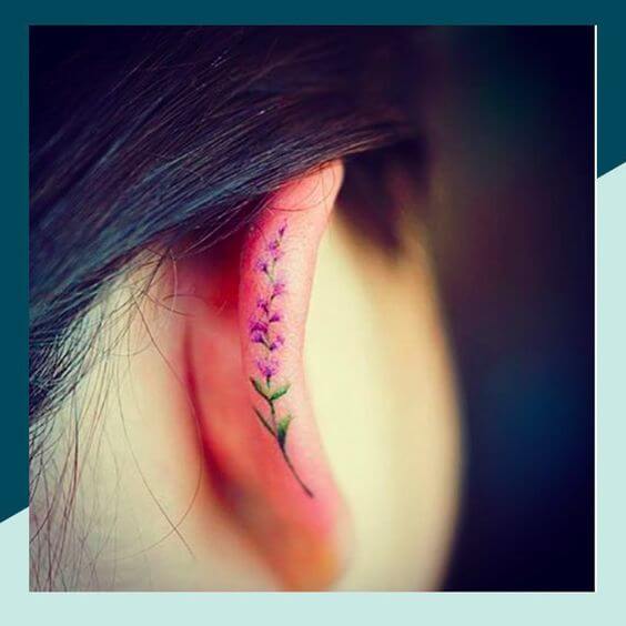 tiny lavender sprig tattoo on ear