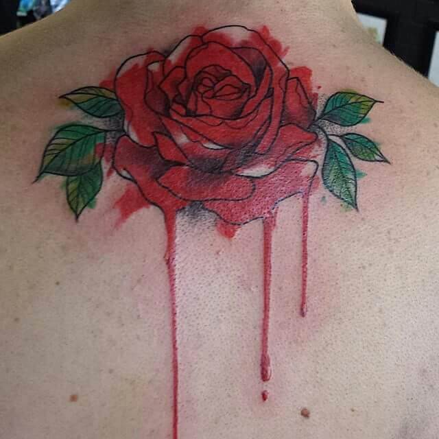 blood dripping from a red rose back neck tattoo design