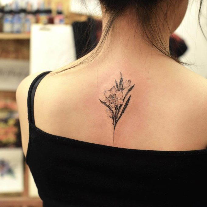 black and white december birth flower narcissus tattoo on back