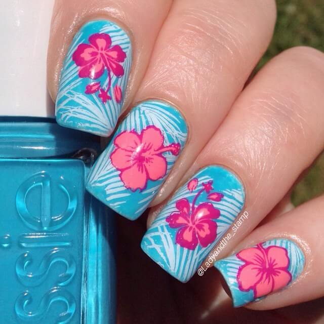 blue and coral hawaiian hibiscus flowers summer nails
