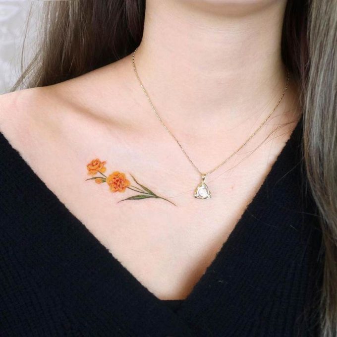 december birth flower narcissus tattoo on chest