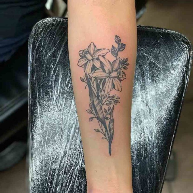 december birth flower narcissus flowers tattoo on forearm