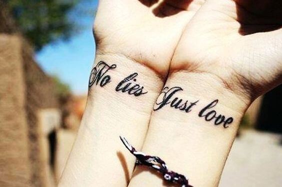 cute font no lies just love tattoo on wrists