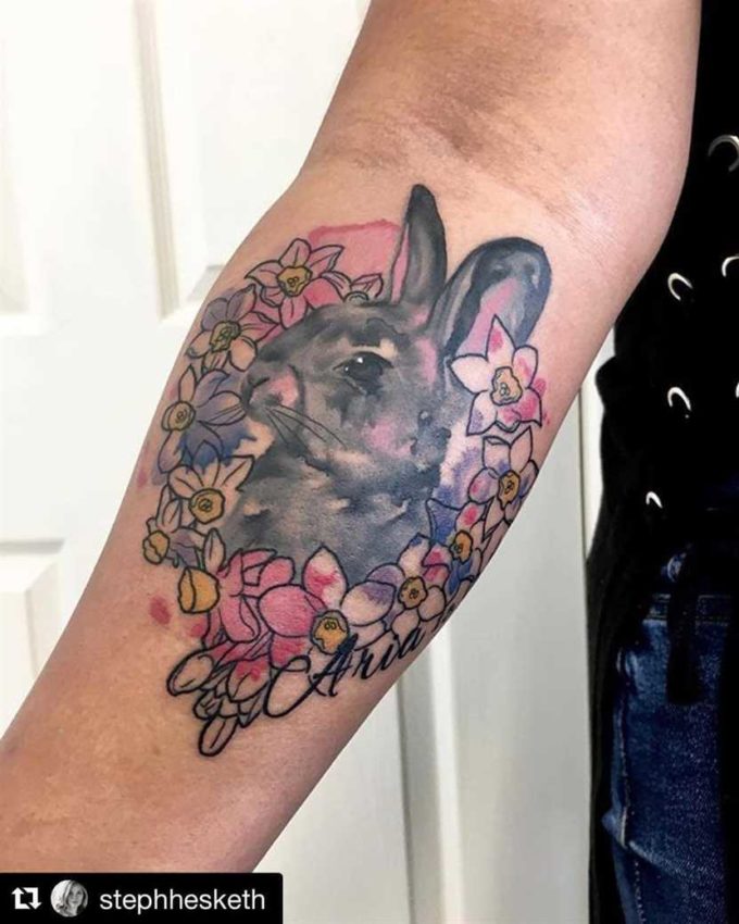 bunny with december birth flowers narcissus tattoo design on forearm
