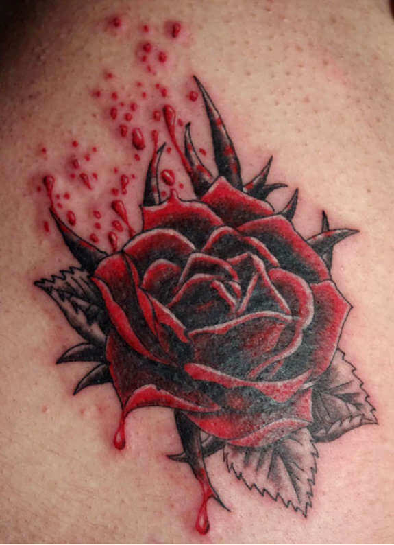 blood droplets on red bleeding rose tattoo design