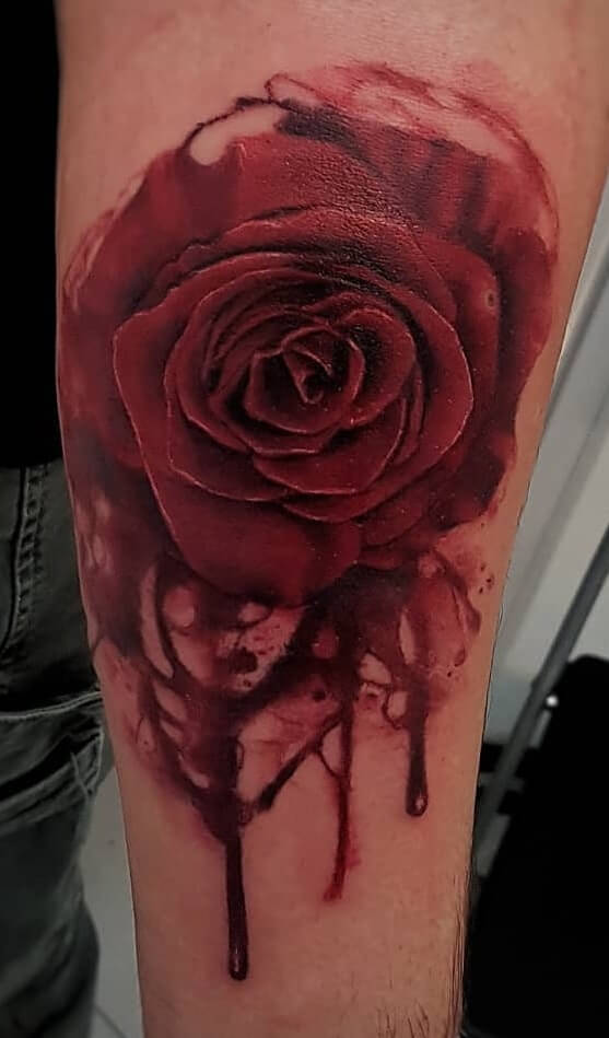deep red bleeding rose tattoo design 