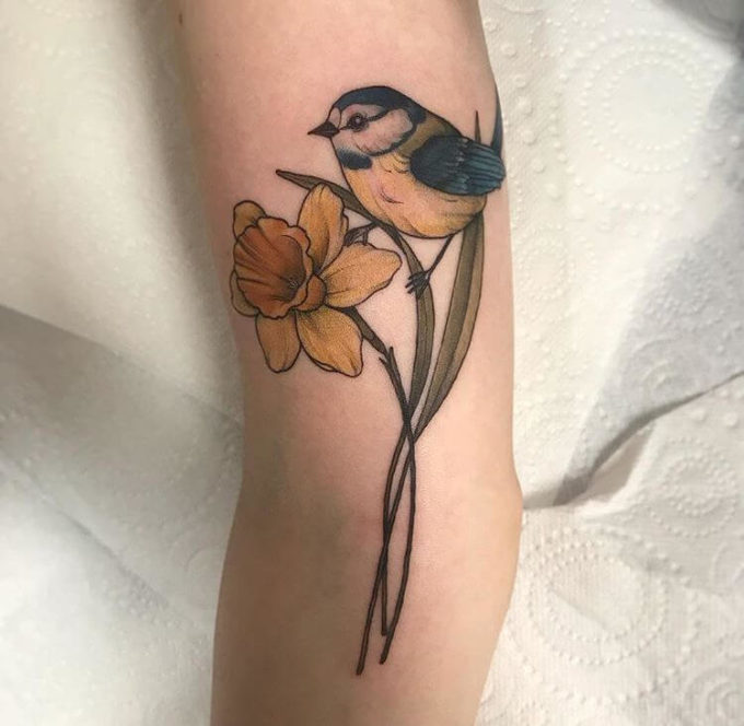 sparrow with december birth flower narcissus tattoo design