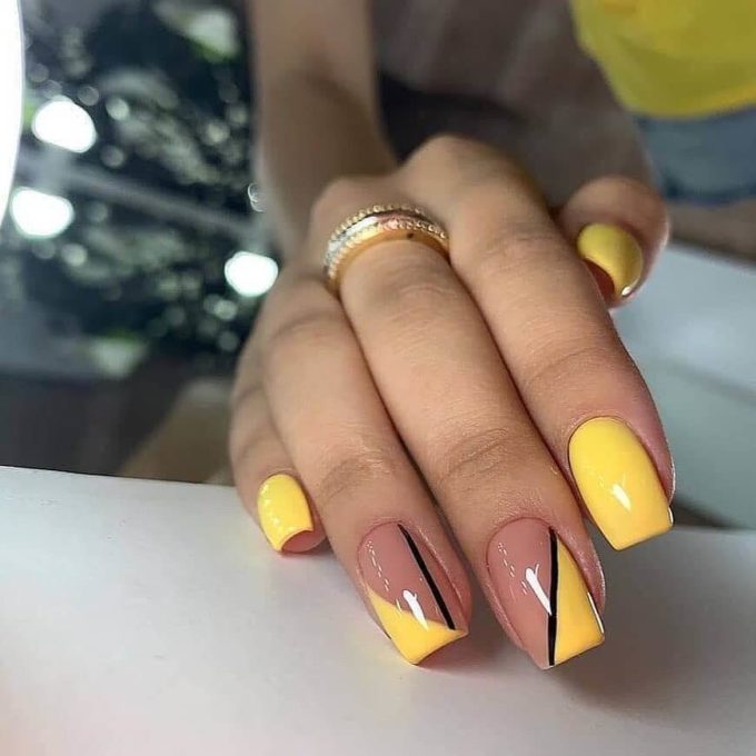 yellow and nude with single black line summer nails