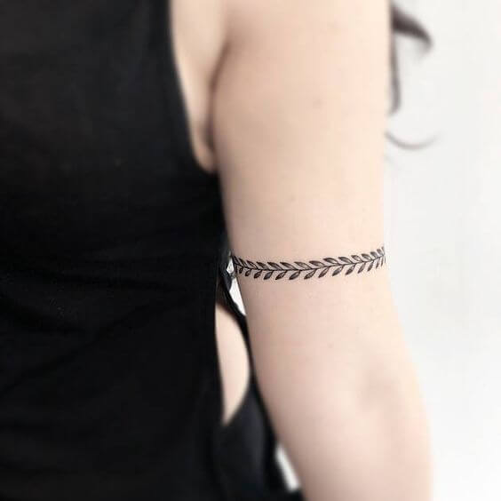 graceful and simple leaf armband tattoo design idea for women