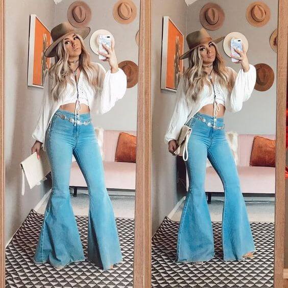 bell-bottom jeans matched with white puff sleeve top shirt and hat cowgirl outfit idea