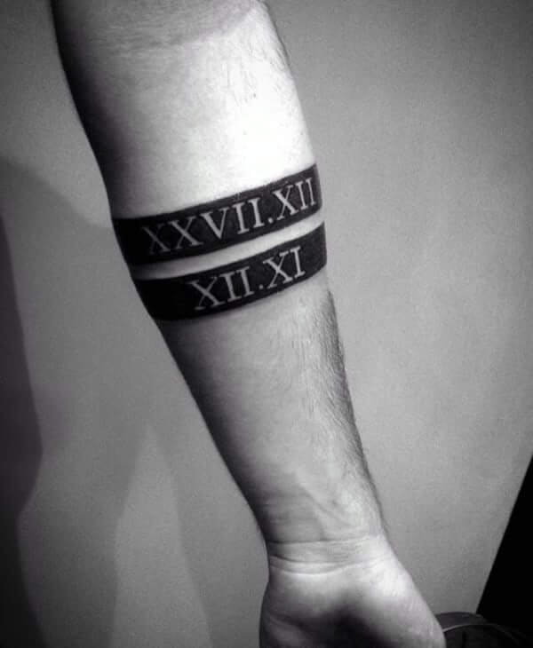roman numbers black band tattoo design on forearm