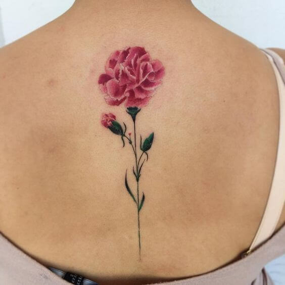 alluring pink carnation January birth flower with bud tattoo design on back