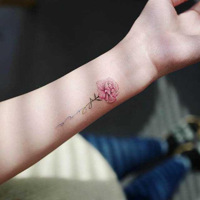 pink carnation January birth flower signature tattoo design idea on wrist