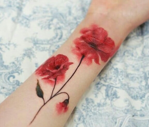 red colored carnation January birth flower with bud tattoo design on forearm