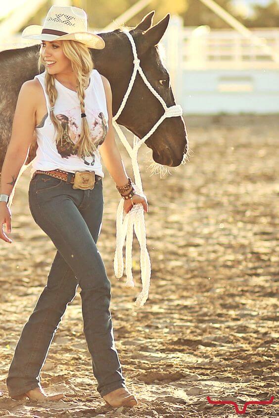 tank-top with jeans and two braids hair with hat cowgirl outfit idea