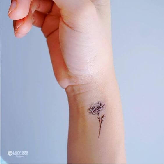 side wrist carnation January flower tattoo design