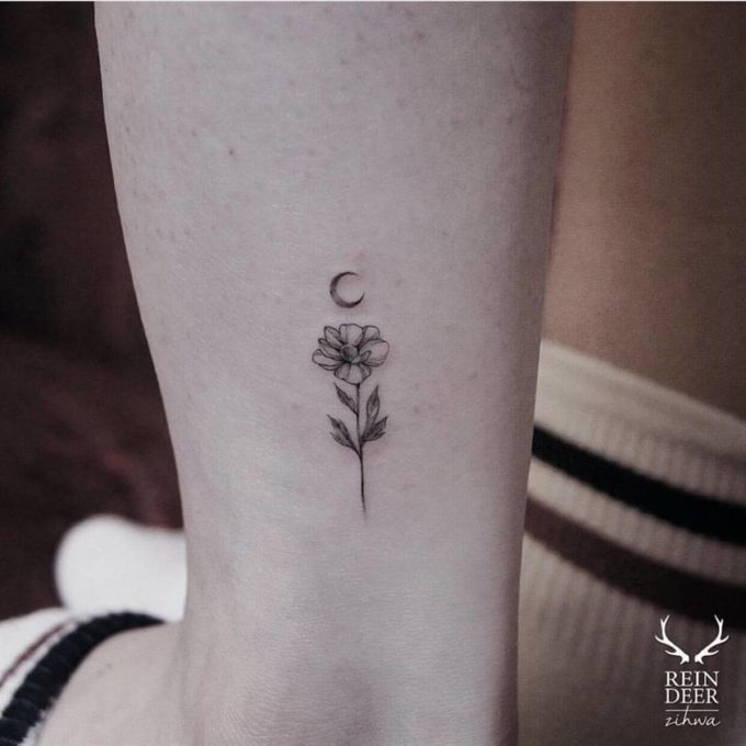 subtle moon and primrose tattoo design on ankle