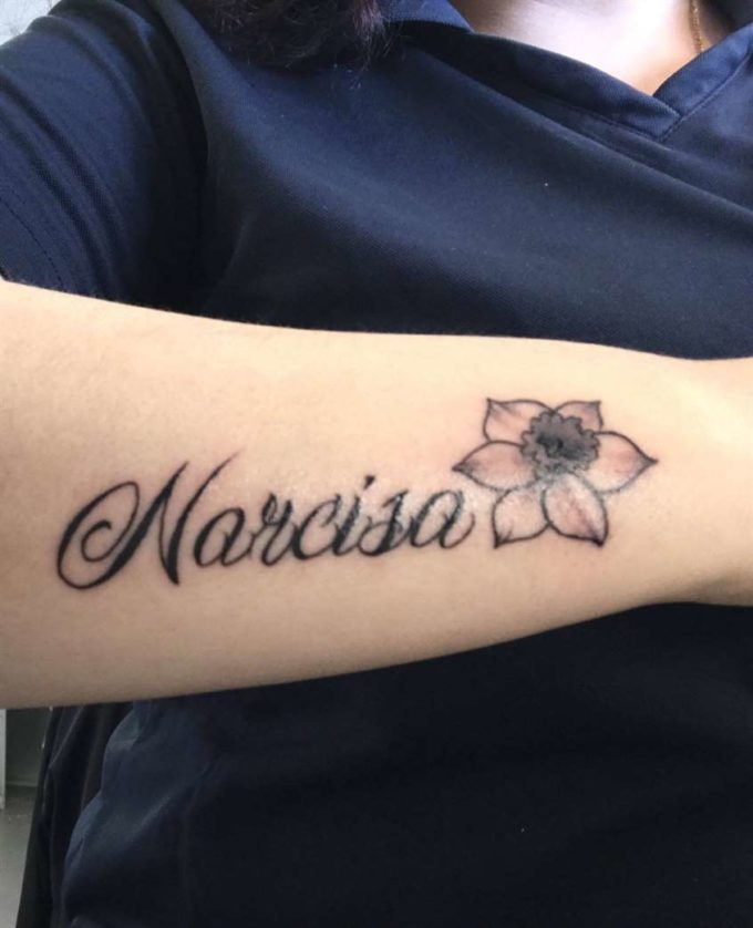 narcissus flower tattoo on side arm