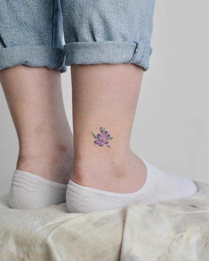 small purple violet flower tattoo design on ankle