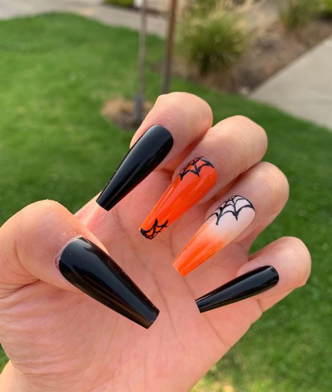 black and orange coffin spider web nail art design
