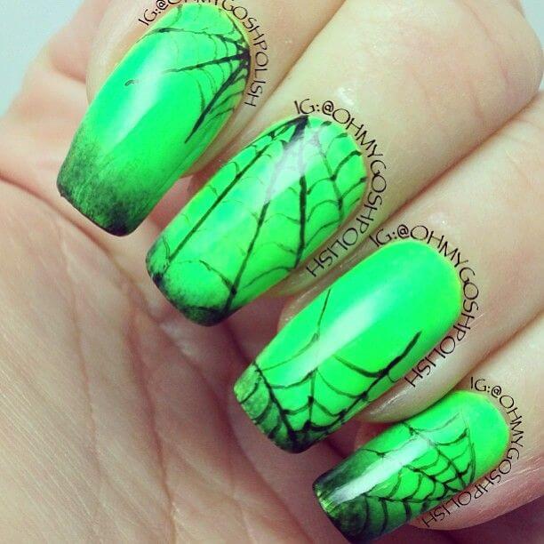 bright neon green with black spider web acrylic coffin nail art design