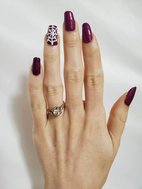 maroon with white spider web nail art design 