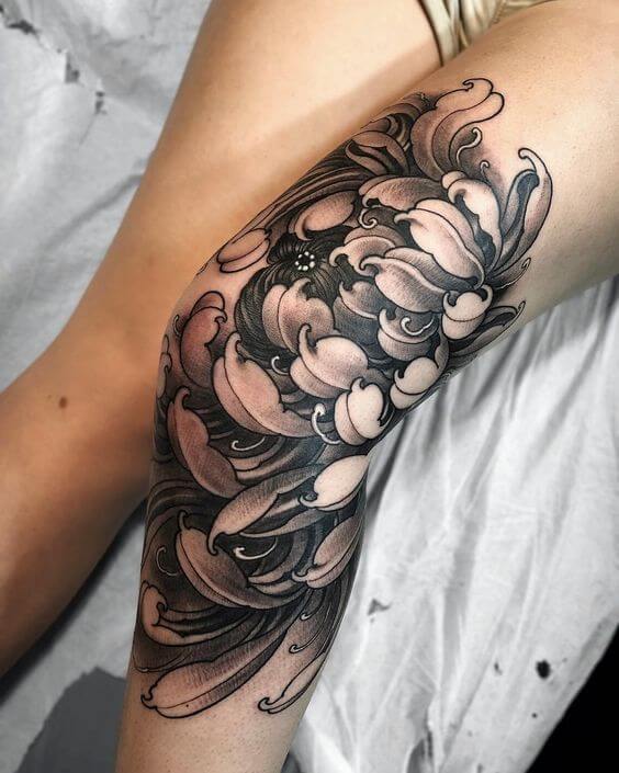 mesmerizing chrysanthemum birth flower tattoo design on knee for females