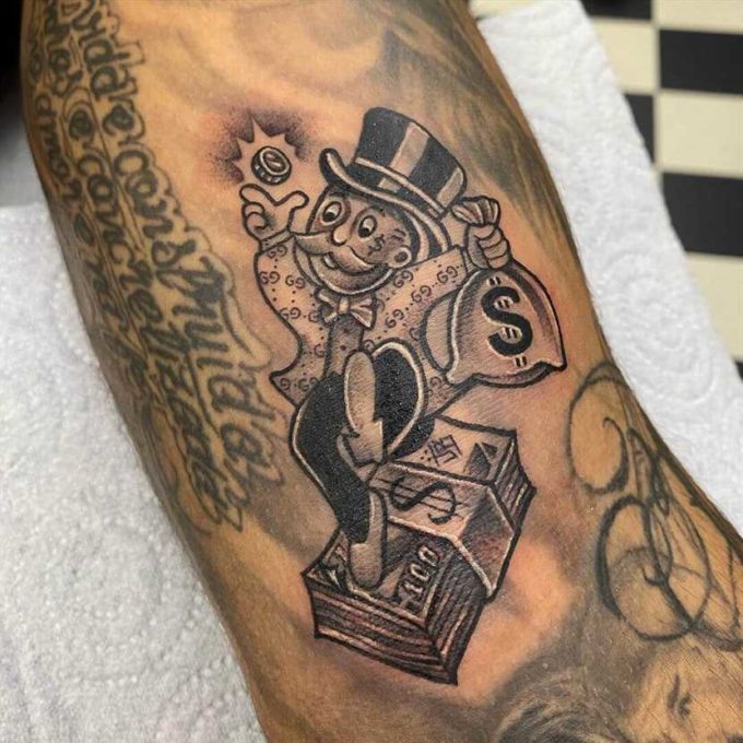 monopoly man with coins bag tattoo design 