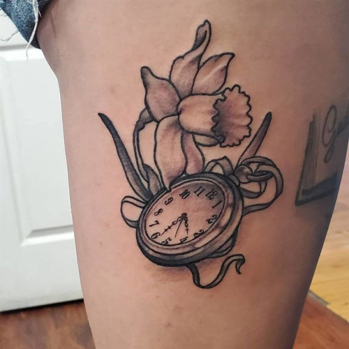clock with birth time and daffodil flower tattoo design idea for march