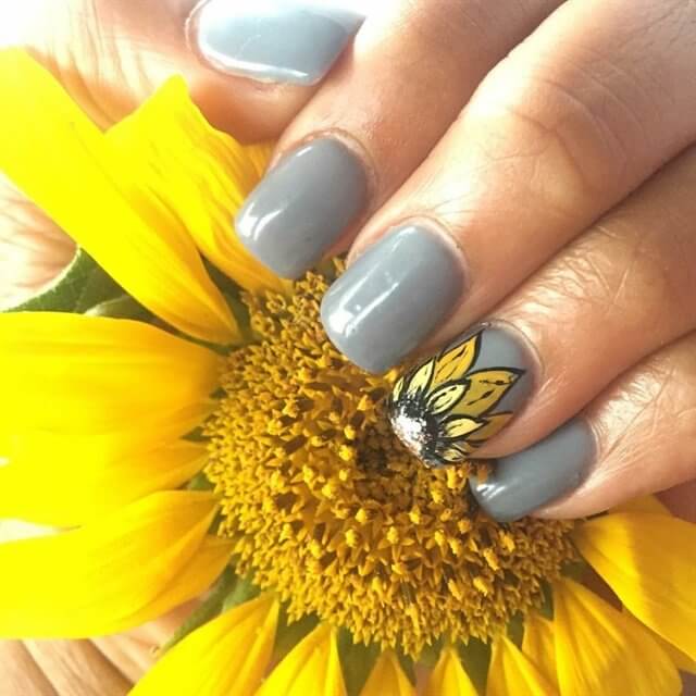 short grey with single sunflower nail art
