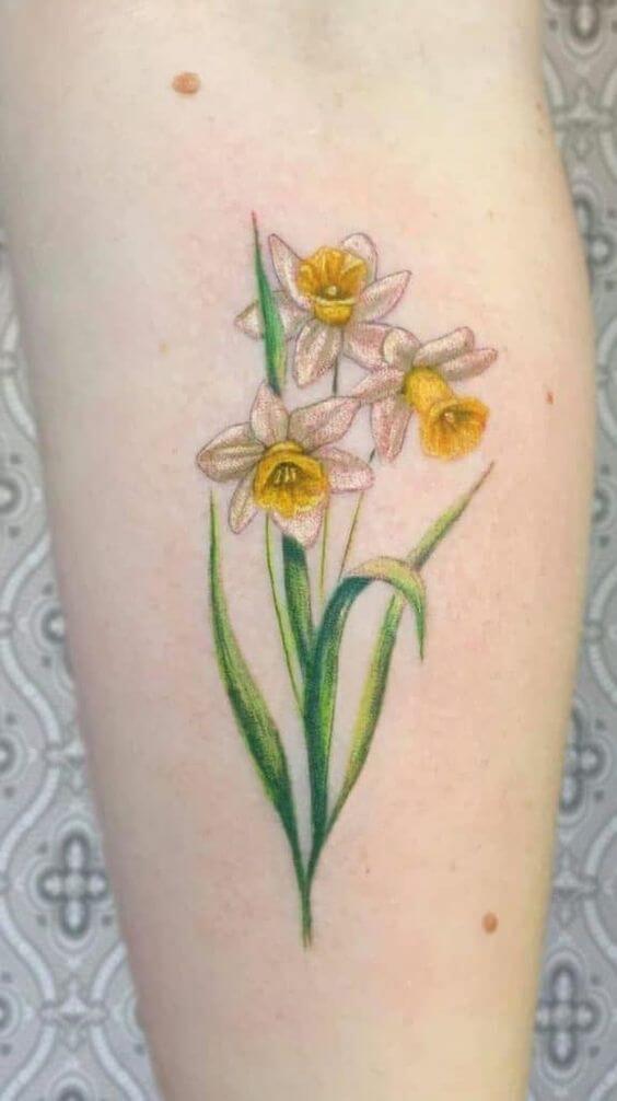 march birth flower daffodils tattoo design idea on forearm for females