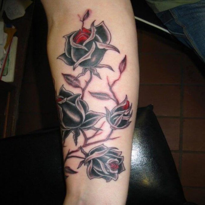 black and red color roses vine tattoo design for men forearm