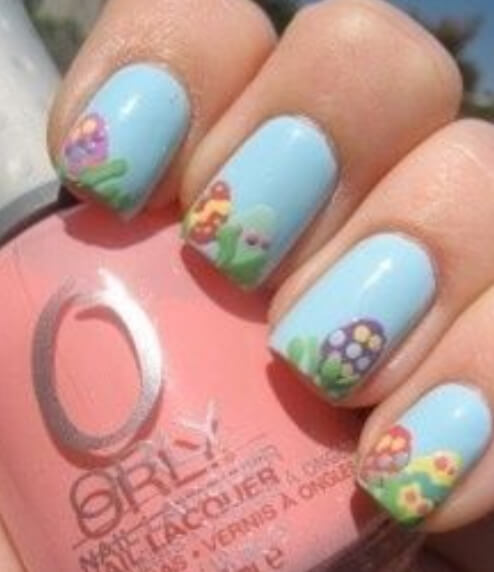 pastel blue easter nails with grass and egg designs