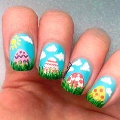 easter egg on grass with blue sky with sun and clouds nail design idea