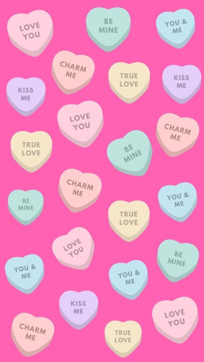 valentines day sugar heart candies with pink background for iphone