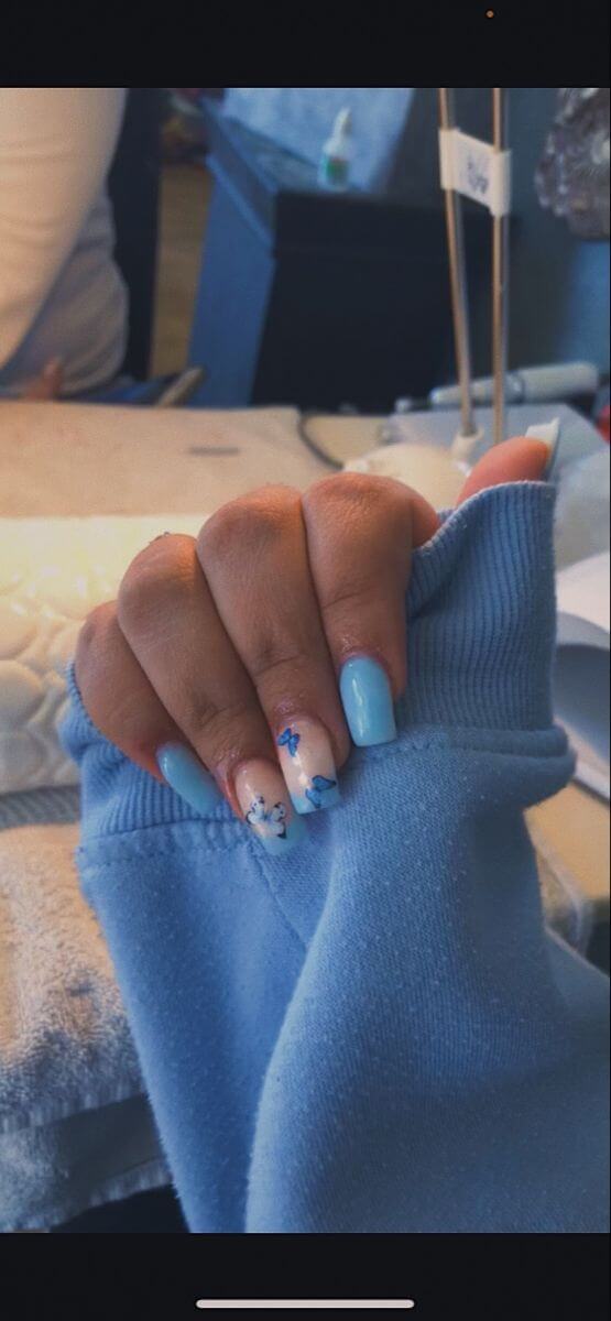 nude and blue acrylic coffin butterfly nail art design idea for spring season
