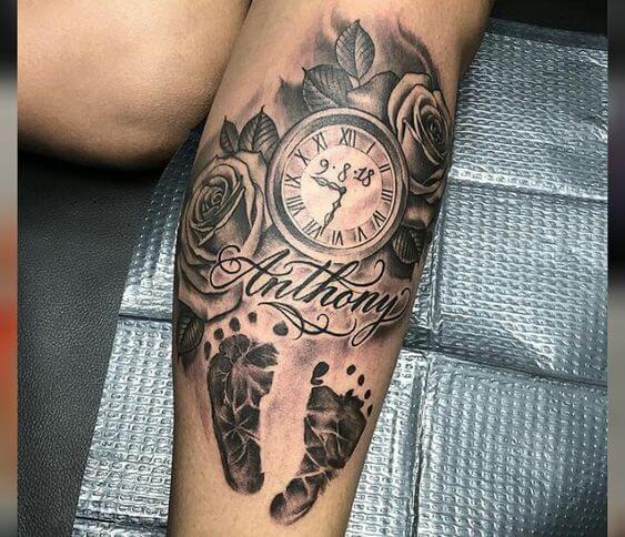 baby foot prints with roses-name and birth clock with time tattoo design idea