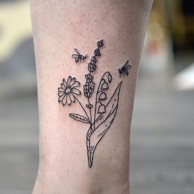 bees with wild flower and lily of the valley may birth flower tattoo design idea