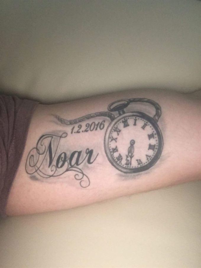 birth clock with name and date tattoo design idea on side inner upper arm