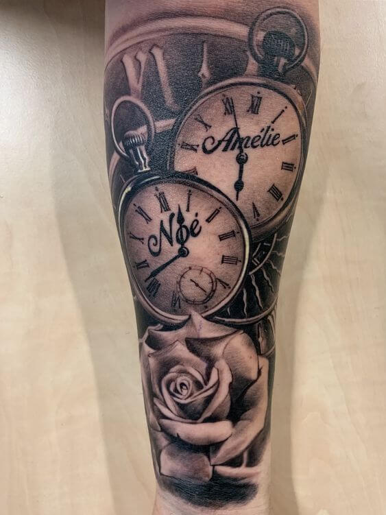 birth clock in background and 2 in front with name and rose tattoo design idea on arm