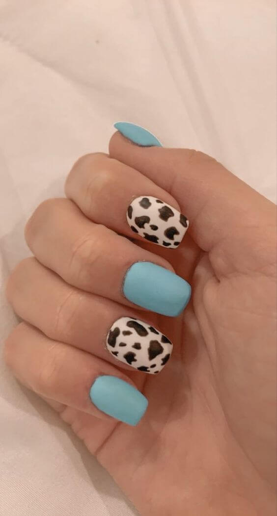 pastel blue with black and white cow skin print nails ideas for spring 2022