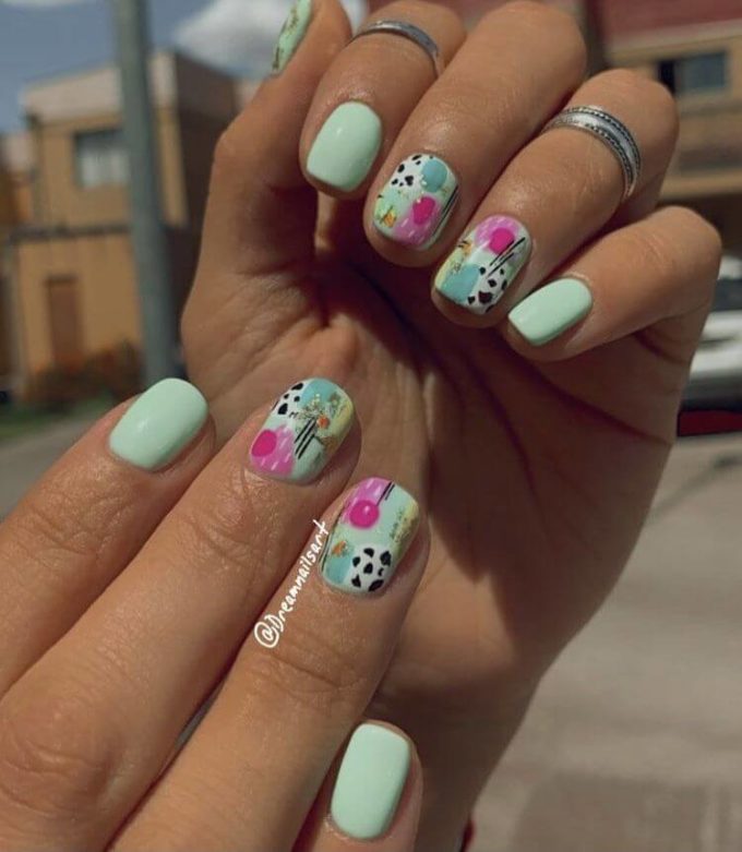 short minty colored with abstract designs nails art idea for spring 2022