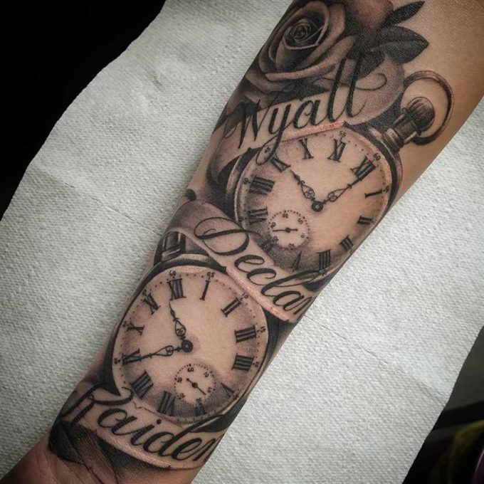 rose with pocket birth clocks and roman names banner tattoo design idea on forearm