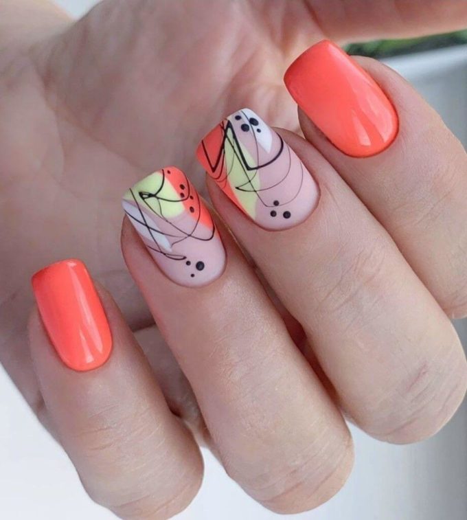 artistic black designs with pastel orange short spring nails ideas 2022